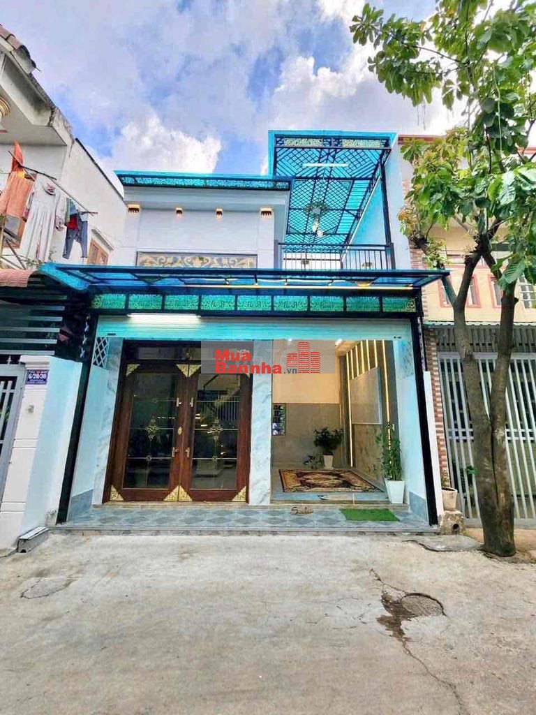 bán nhà trệt lầu xây ở đường bê tông 6 m gần chợ Tân Long