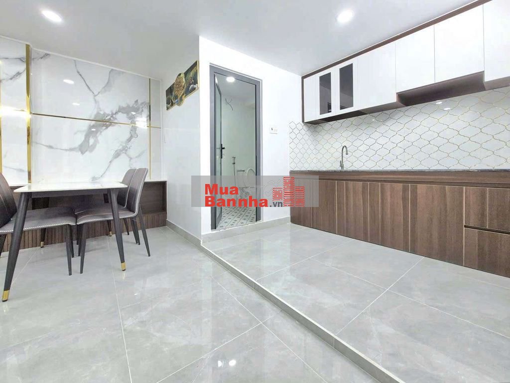 nhà 7x10m 1 lửng 3pn kế hẻm xe hơi Huỳnh Tấn Phát