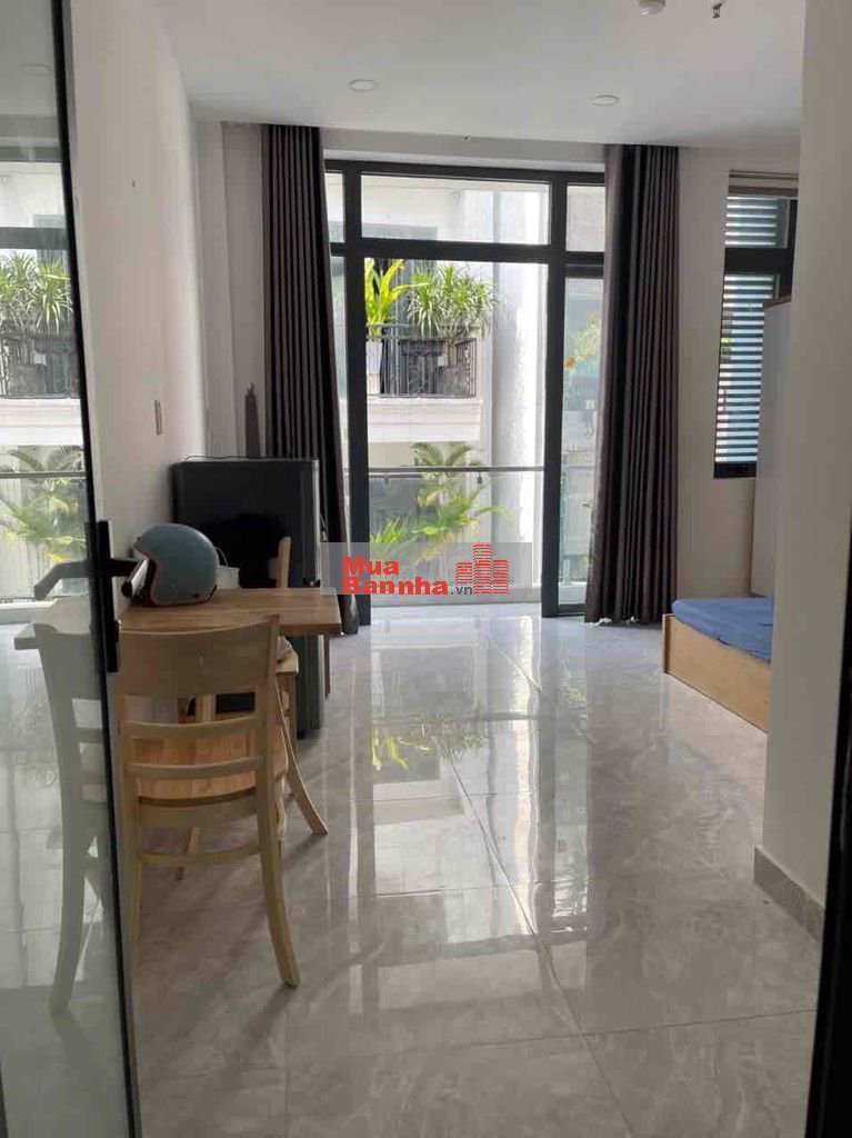 Toà nhà Huỳnh Văn Bánh thu nhập 120tr/t 6 x 23m hầm 6 lầu ST 23 phòng